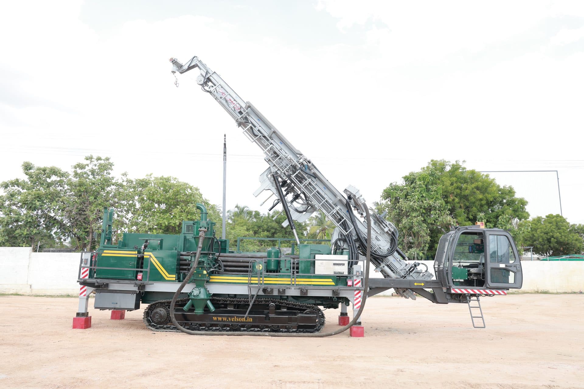 DRC 350 crawler-mounted RC drill - full side view with the mast raised for near-vertical drilling