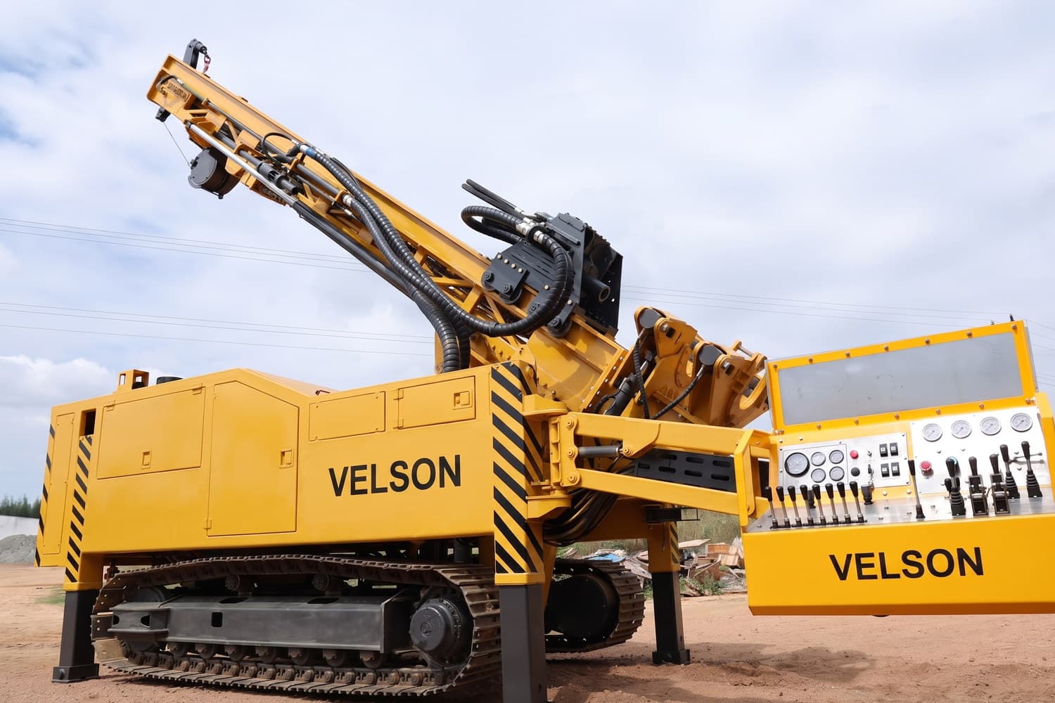 Velson V9XL crawler drill with the mast tilted off vertical for an angled hole